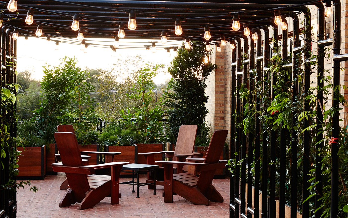 Picture of an outside patio with seating at Hotel Emma.